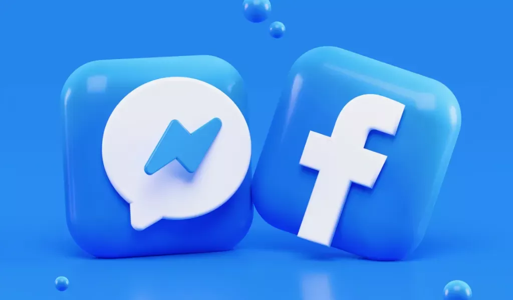 Bild på en Facebook logotyp och facebook chat logotyp i 3d. Med blå bakgrund.