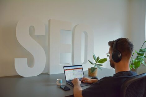 a seo expert sitting in front of a laptop computer